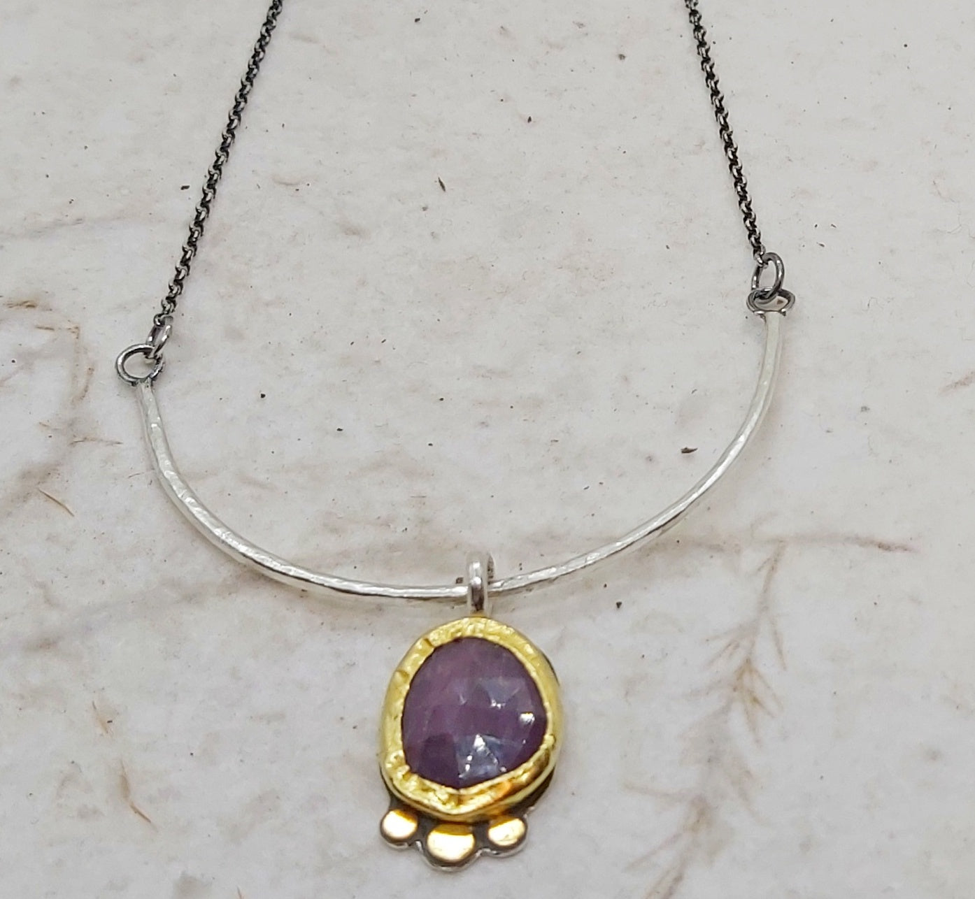 Sapphire pendant in 22k bezel and silver