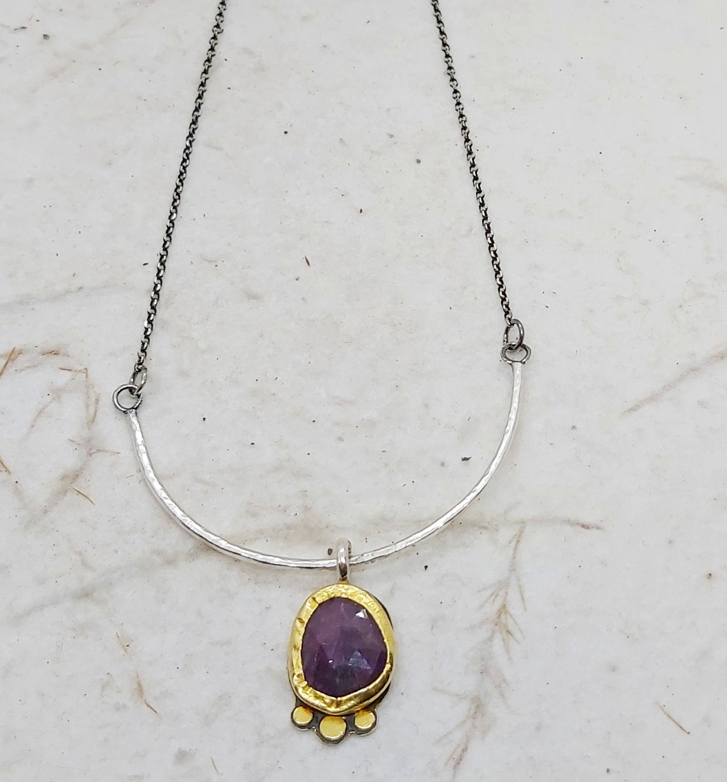 Sapphire pendant in 22k bezel and silver
