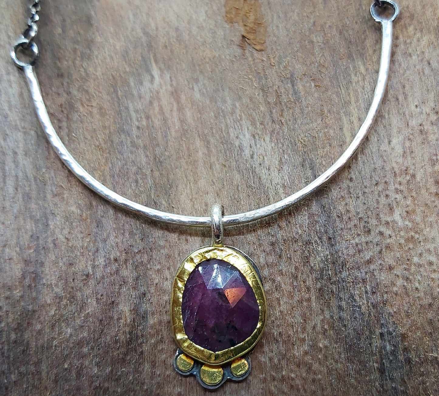 Sapphire pendant in 22k bezel and silver