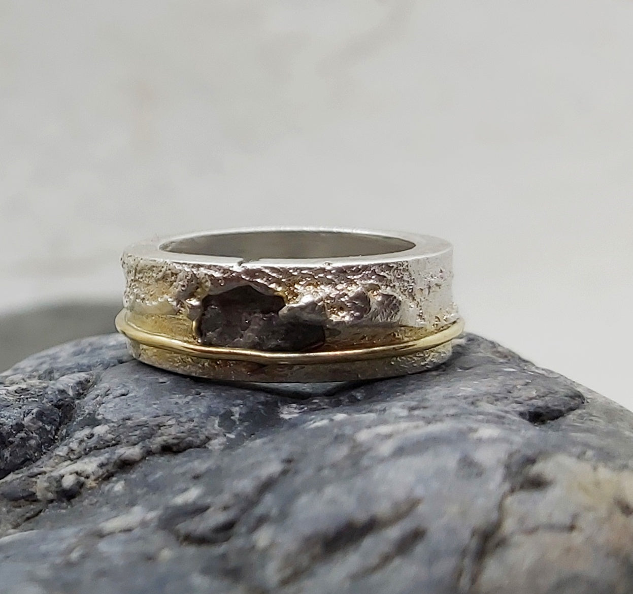 Raw gray diamond sand cast in silver