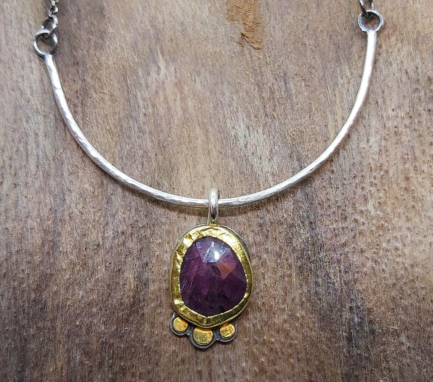 Sapphire pendant in 22k bezel and silver